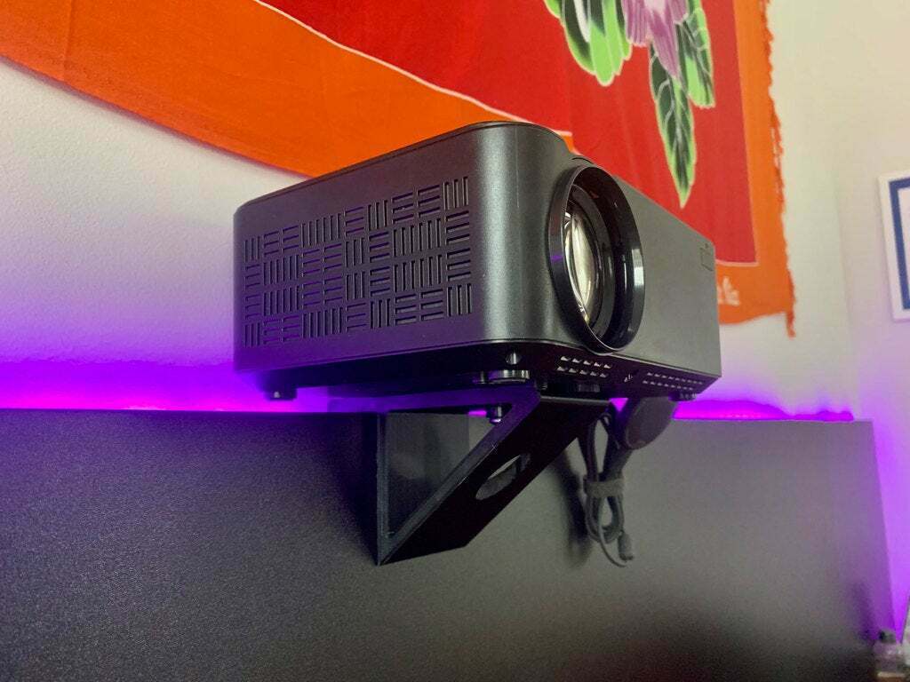 A photo of my projector mounted to the headboard.
